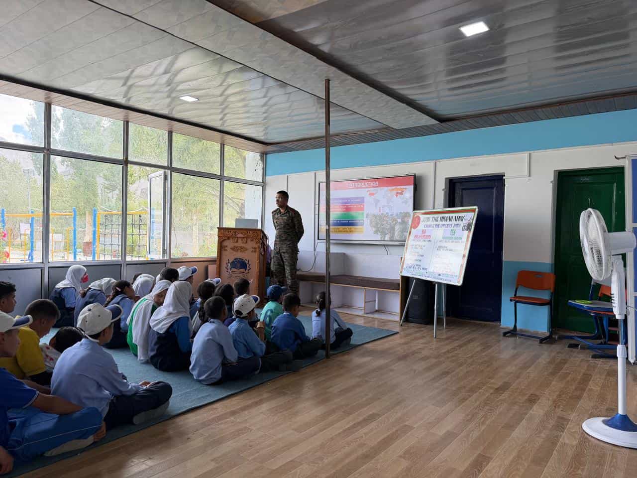 An Indian Army officer delivering a career guidance session to seated students